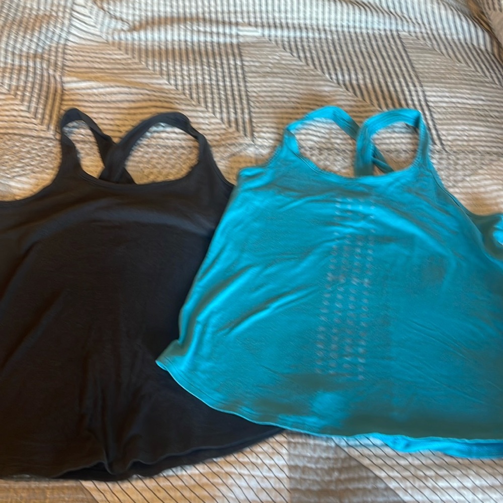 Under Armour tank tops.,
